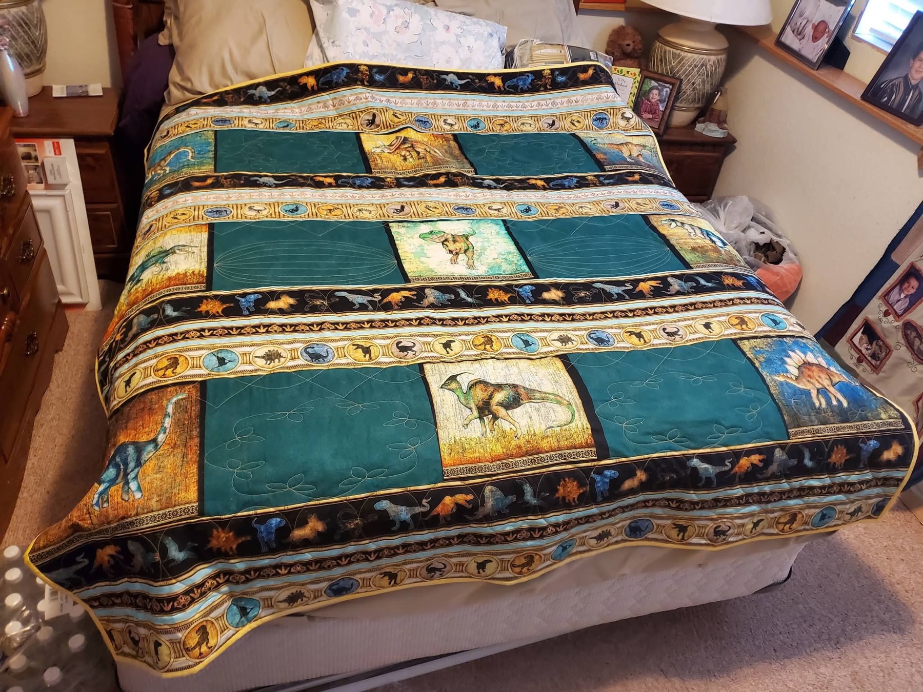 Dinosaur-themed quilt handmade by Tanya
