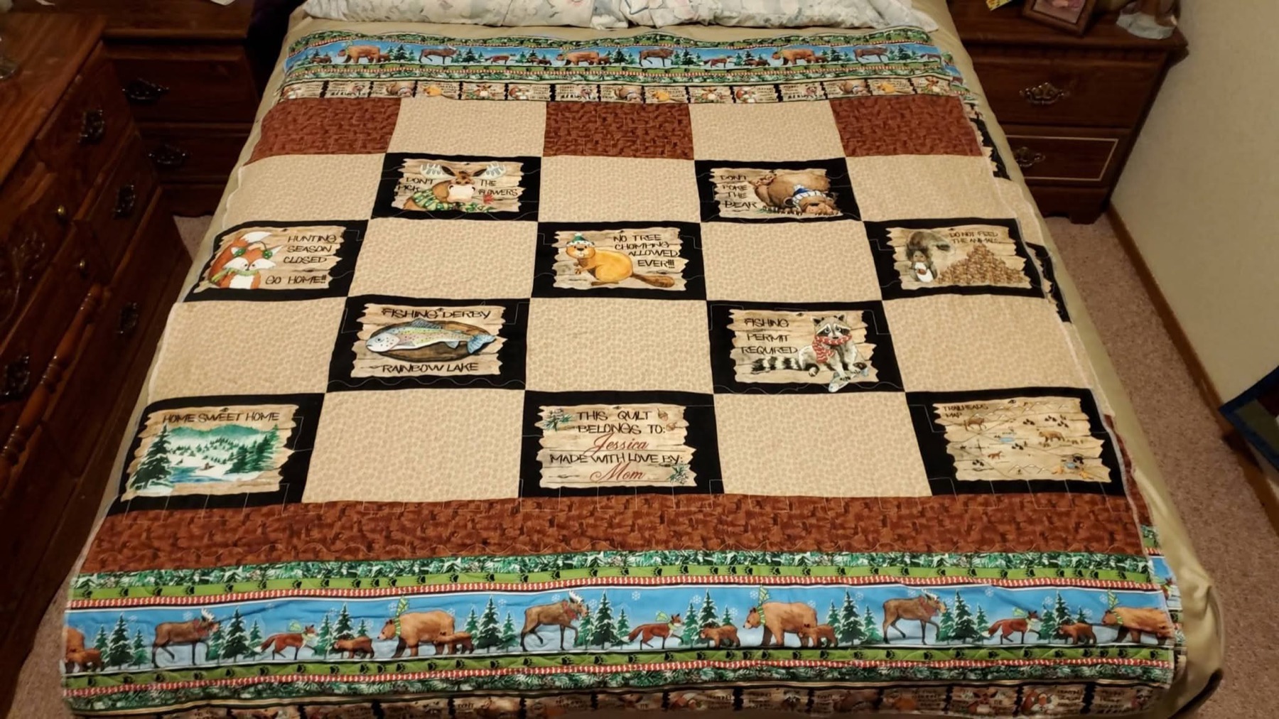 Alaska cabin and checkerboard pattern quilt made by Tanya